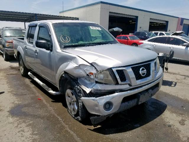 1N6AD07UX9C428152 - 2009 NISSAN FRONTIER C SILVER photo 1