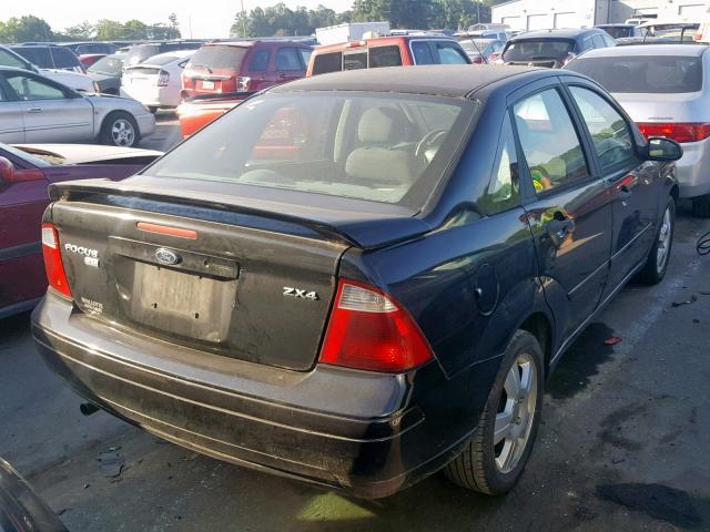 1FAFP34N35W184289 - 2005 FORD FOCUS ZX4 BLACK photo 4