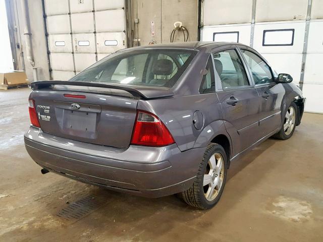 1FAHP34N37W234863 - 2007 FORD FOCUS ZX4 GRAY photo 4