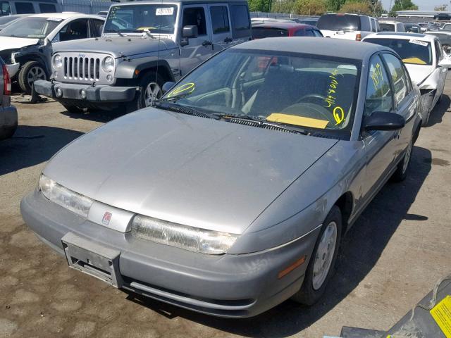 1G8ZF528XXZ101763 - 1999 SATURN SL SILVER photo 2