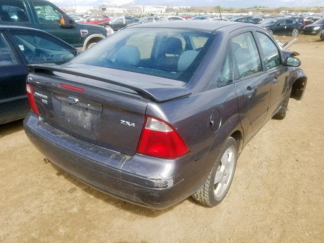 1FAFP34N06W240173 - 2006 FORD FOCUS ZX4 GRAY photo 4