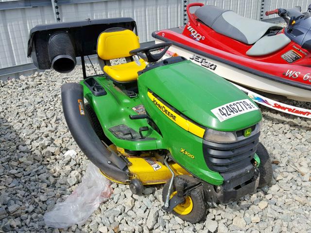 1M0X300CPDM265807 - 2000 JOHN DEERE 300B GREEN photo 1