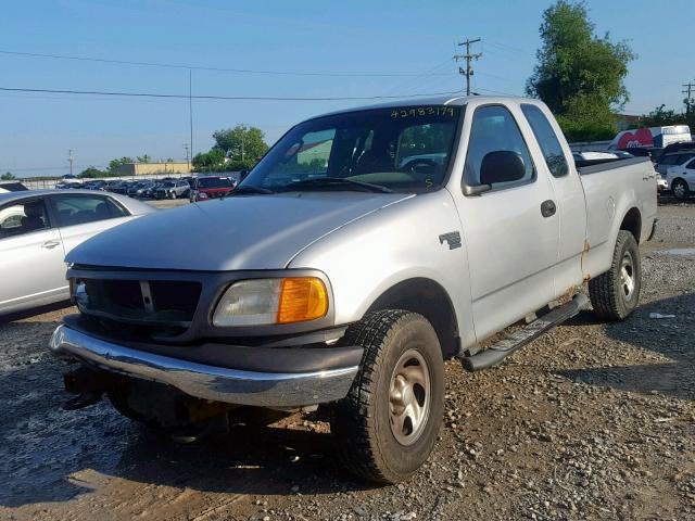 2FTRX18W14CA78724 - 2004 FORD F-150 HERI GRAY photo 2