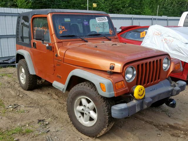 1J4FA49S7YP793765 - 2000 JEEP WRANGLER / ORANGE photo 1