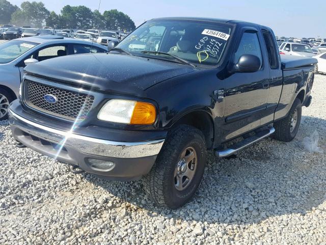 2FTRX18W34CA25572 - 2004 FORD F-150 HERI BLACK photo 2