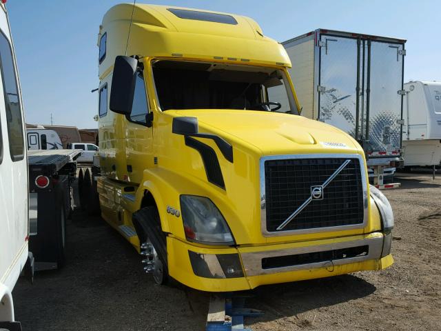 4V4N99EH4FN179772 - 2015 VOLVO VN VNL YELLOW photo 1