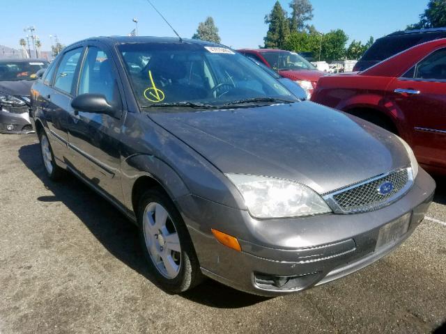 1FAHP34N07W107603 - 2007 FORD FOCUS ZX4 GRAY photo 1