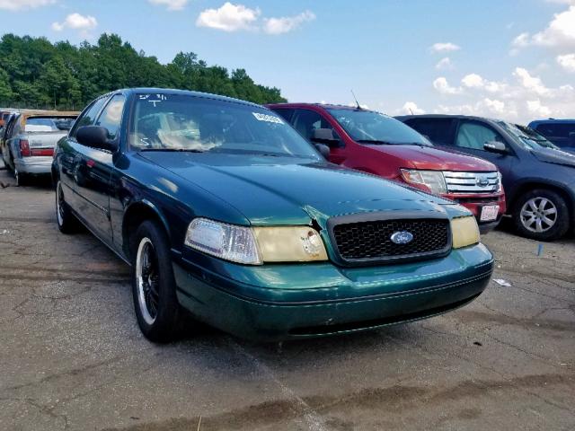 2FAFP71W6YX208694 - 2000 FORD CROWN VICT GREEN photo 1