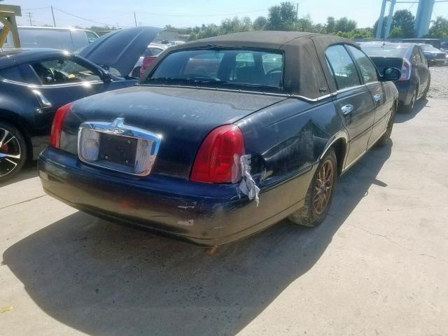 1LNFM82W5XY601541 - 1999 LINCOLN TOWN CAR S BLACK photo 4