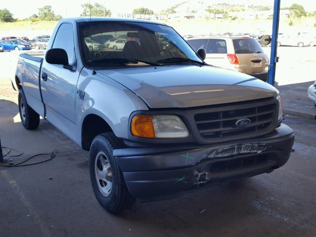 2FTRF18WX4CA19884 - 2004 FORD F-150 HERI SILVER photo 1