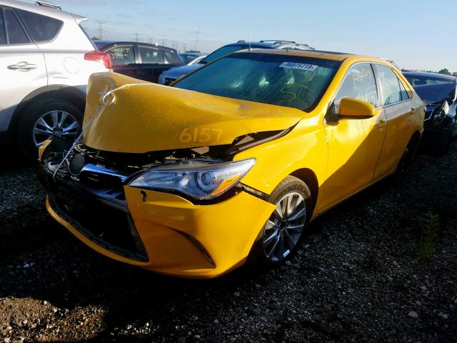 4T1BD1FK4FU148175 - 2015 TOYOTA CAMRY HYBR YELLOW photo 2