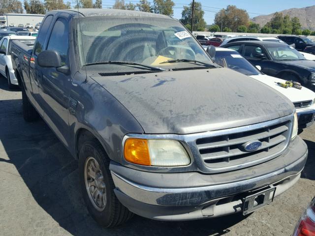 2FTRX17274CA07283 - 2004 FORD F-150 HERI GRAY photo 1