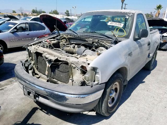 2FTRF072X4CA10319 - 2004 FORD F-150 HERI SILVER photo 2