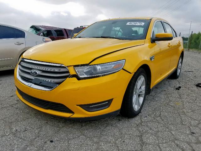 1FAHP2E86EG141555 - 2014 FORD TAURUS SEL YELLOW photo 2