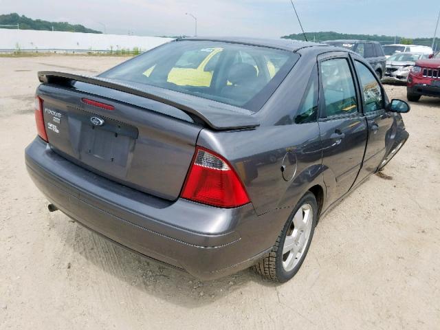 1FAHP34N77W178085 - 2007 FORD FOCUS ZX4 GRAY photo 4