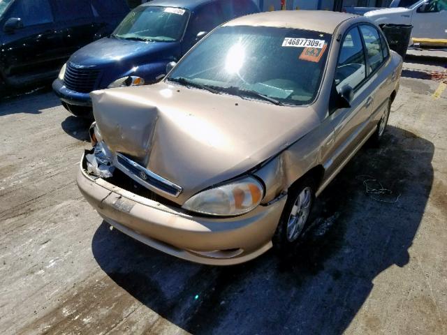 KNADC123126194539 - 2002 KIA RIO GOLD photo 2