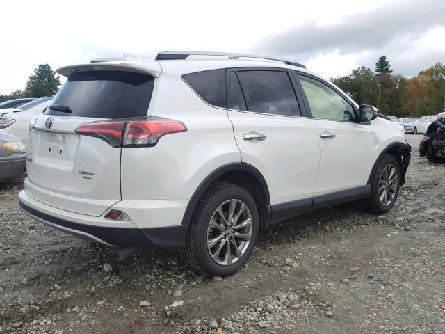 JTMDFREV7JJ212916 - 2018 TOYOTA RAV4 LIMIT WHITE photo 4