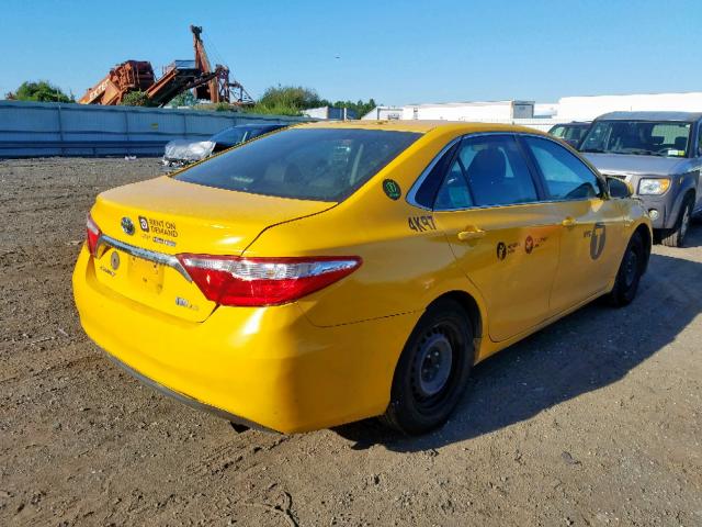 4T1BD1FK5FU151683 - 2015 TOYOTA CAMRY HYBR YELLOW photo 4