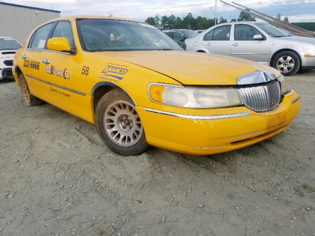 1LNHM83W6YY863996 - 2000 LINCOLN TOWN CAR C YELLOW photo 1