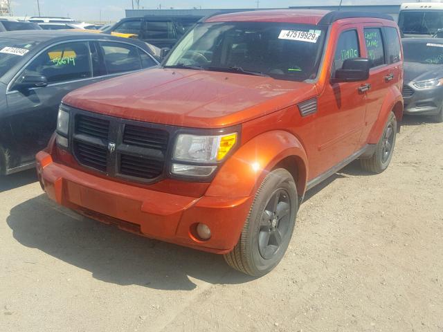 1D8GU58K49W524883 - 2009 DODGE NITRO SLT ORANGE photo 2