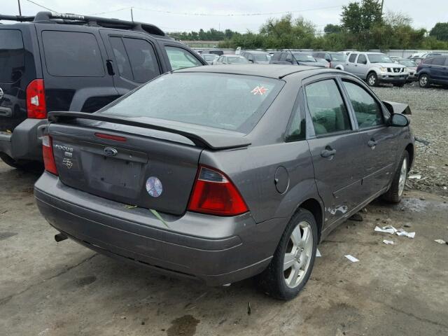 1FAFP34N77W230547 - 2007 FORD FOCUS ZX4 GRAY photo 4