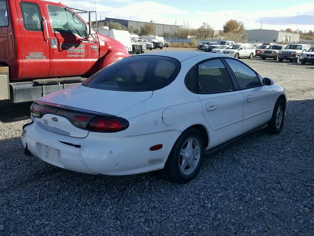 1FAFP53U4XG251659 - 1999 FORD TAURUS SE WHITE photo 4