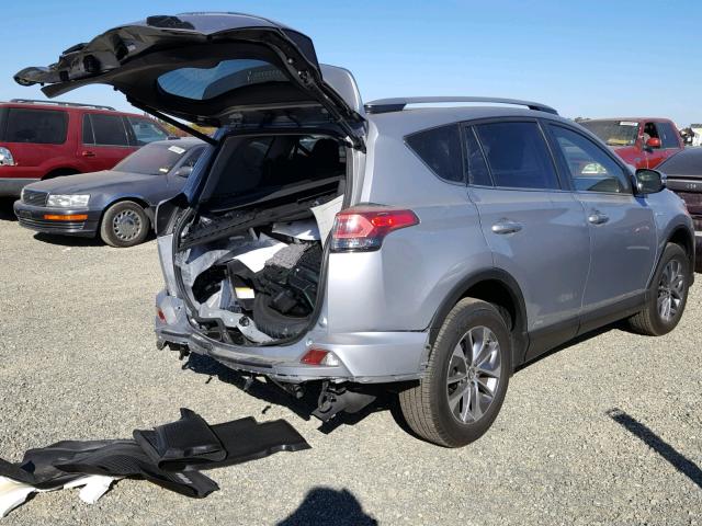 JTMRJREV2JD183943 - 2018 TOYOTA RAV4 HV LE SILVER photo 4