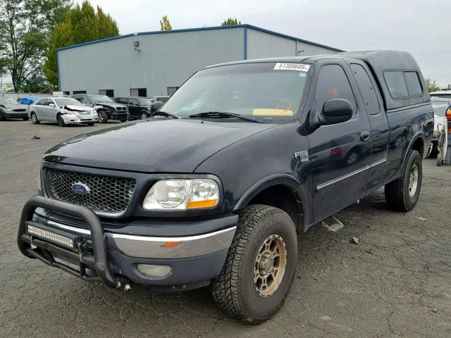 1FTRX18L3YKA69675 - 2000 FORD F150 BLACK photo 2