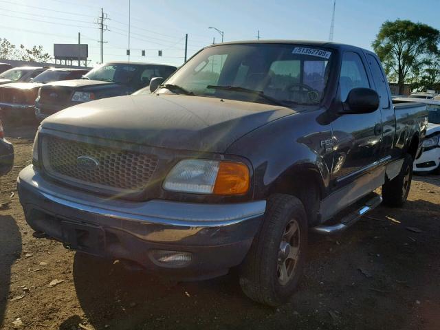 2FTRX18W04CA18594 - 2004 FORD F-150 HERI BLACK photo 2