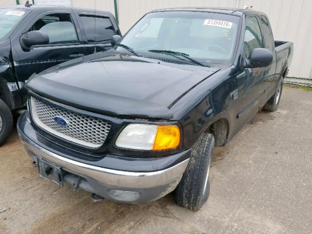 2FTRX18WX4CA30879 - 2004 FORD F-150 HERI BLACK photo 2