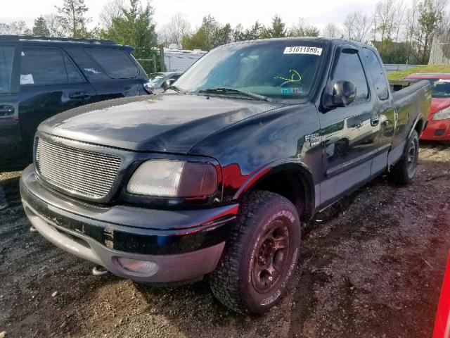 1FTRX18W22NB94991 - 2002 FORD F150 BLACK photo 2