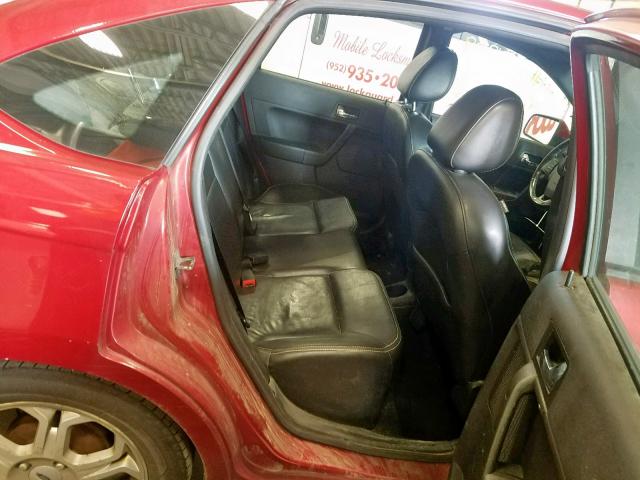 1FAHP36N79W252587 - 2009 FORD FOCUS SES RED photo 6