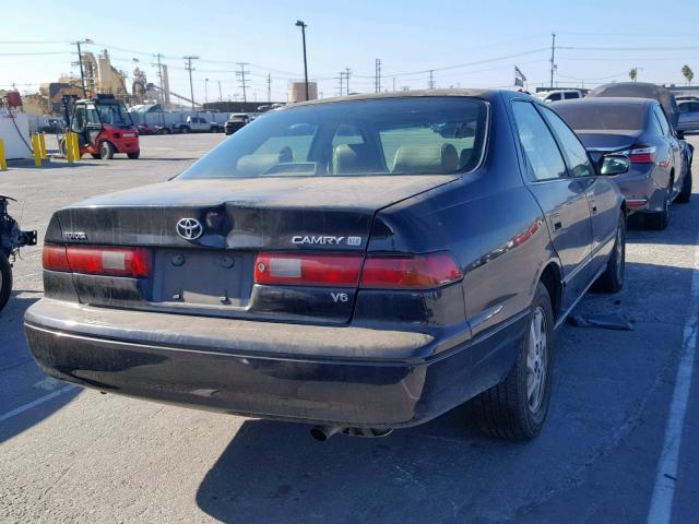 JT2BF28K9X0169767 - 1999 TOYOTA CAMRY LE BLACK photo 4