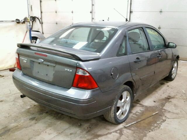 1FAFP34N26W102229 - 2006 FORD FOCUS ZX4 GRAY photo 4