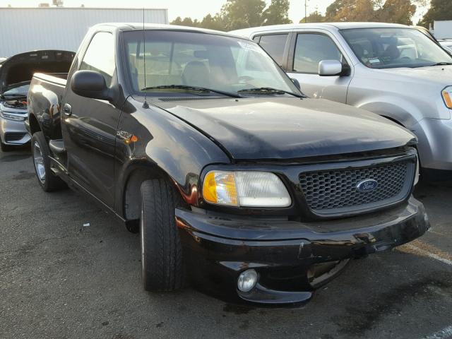 2FTZF0735XCB05318 - 1999 FORD F150 SVT L BLACK photo 1