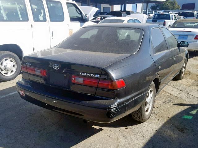 JT2BG22K3X0288615 - 1999 TOYOTA CAMRY LE BLACK photo 4