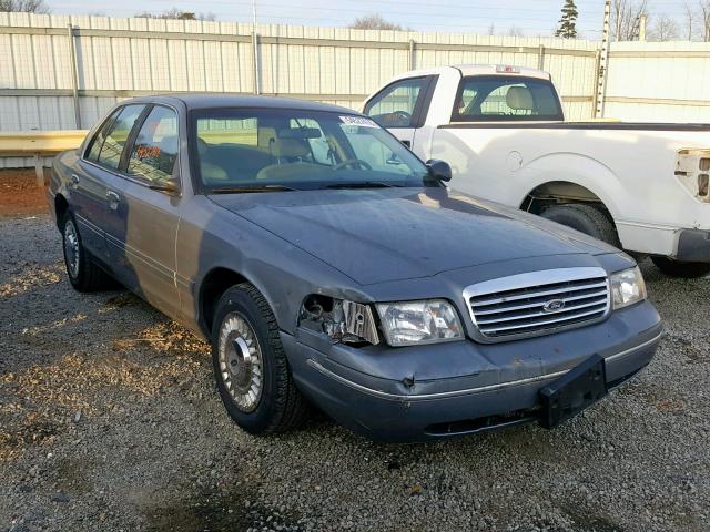 2FAFP71W4XX133881 - 1999 FORD CROWN VICT GRAY photo 1