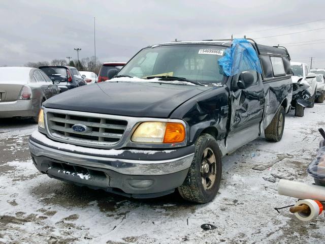 2FTRF17W44CA39811 - 2004 FORD F-150 HERI BLACK photo 2