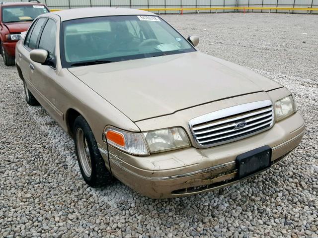 2FAFP74W9XX166399 - 1999 FORD CROWN VICT GOLD photo 1