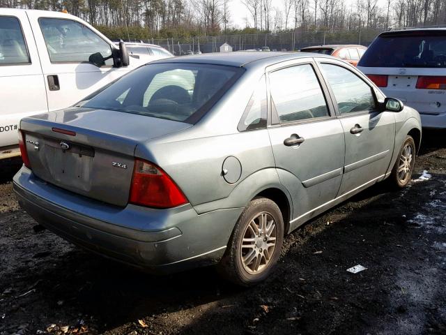 1FAFP34N45W195091 - 2005 FORD FOCUS ZX4 GREEN photo 4