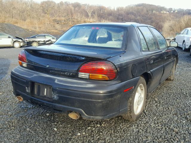 1G2NW52M3VC856081 - 1997 PONTIAC GRAND AM G BLACK photo 4