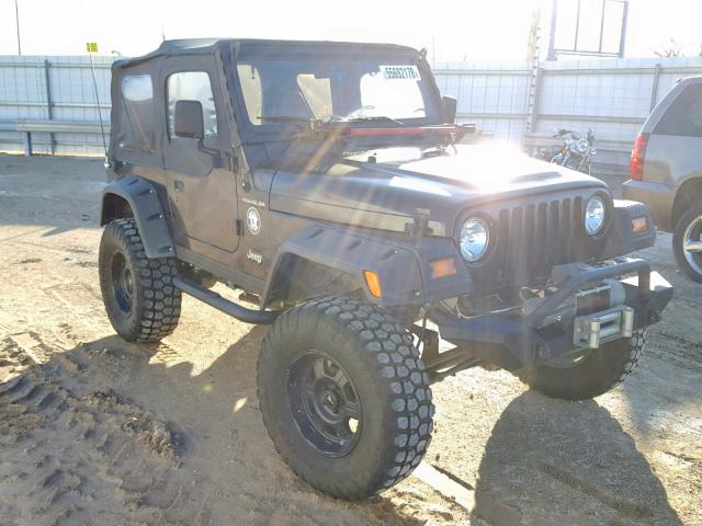 1J4FY29P6XP467689 - 1999 JEEP WRANGLER / BLACK photo 1