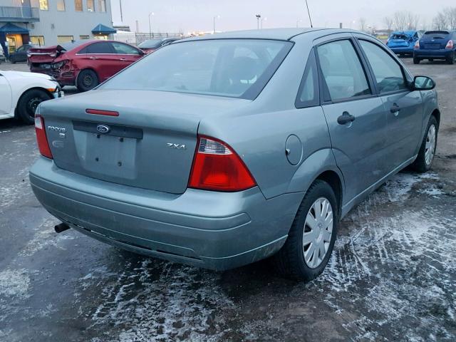 1FAFP34N35W258889 - 2005 FORD FOCUS ZX4 GREEN photo 4