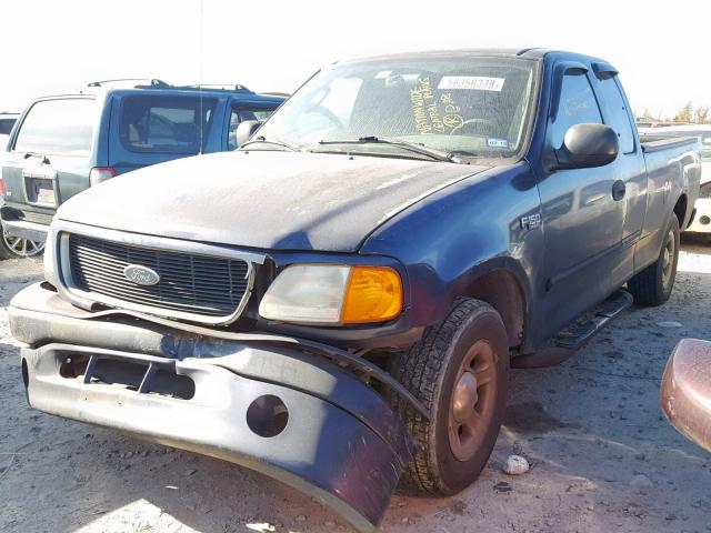 2FTRX17274CA10927 - 2004 FORD F-150 HERI BLUE photo 2