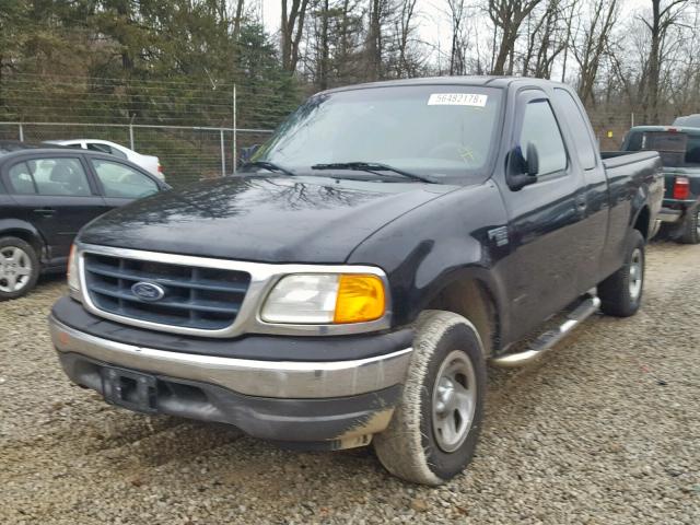 2FTRX18W34CA64257 - 2004 FORD F-150 HERI BLACK photo 2