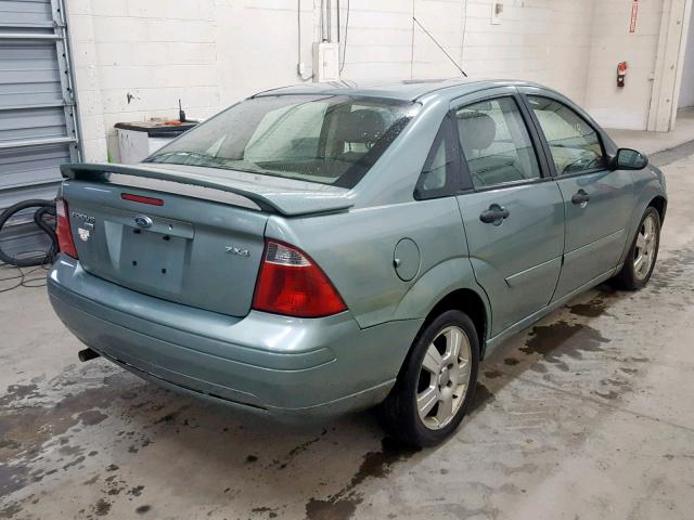 1FAFP34N95W174754 - 2005 FORD FOCUS ZX4 GREEN photo 4