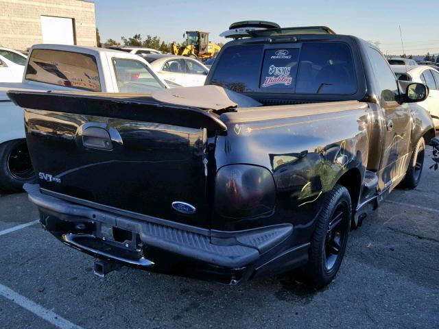 2FTRF07364CA18118 - 2004 FORD F150 SVT L BLACK photo 4