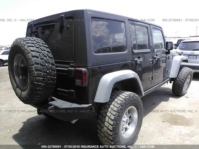 1J4HA6H12BL621039 - 2011 JEEP WRANGLER UNLIMITE RUBICON BLACK photo 4