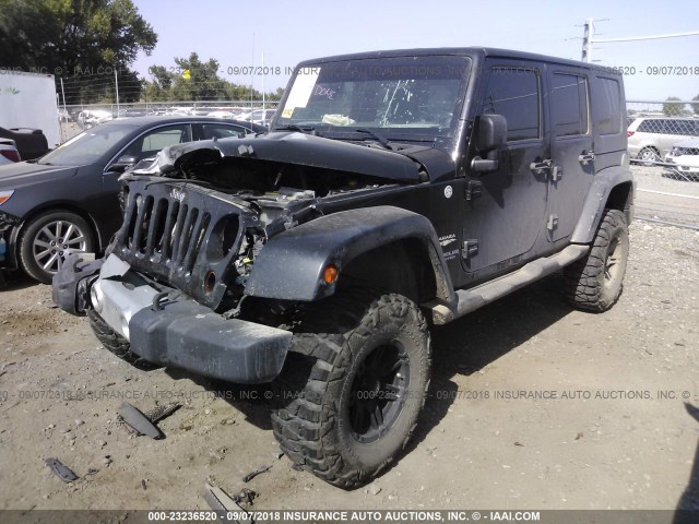 1J4BA5H16AL111811 - 2010 JEEP WRANGLER UNLIMITE SAHARA BLACK photo 2