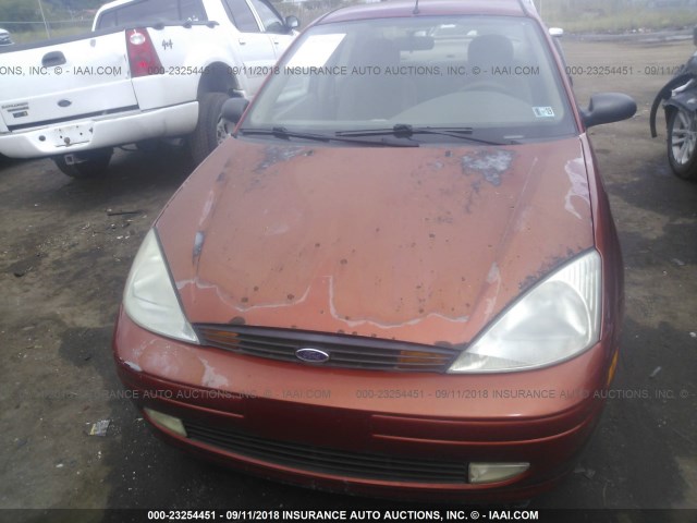 1FAFP3434YW361516 - 2000 FORD FOCUS SE/SE SPORT ORANGE photo 6